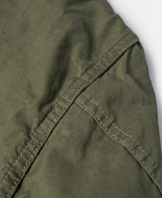 Olive fatigue jacket shoulder with stitched seam detail