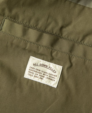 Olive down parka care label patch on outer fabric panel
