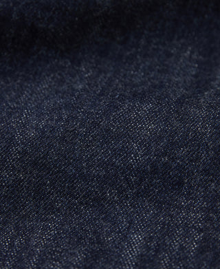 Indigo denim jacket fabric texture, close-up of woven surface