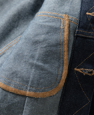 Indigo denim jacket curved pocket opening with orange-brown contrast stitching