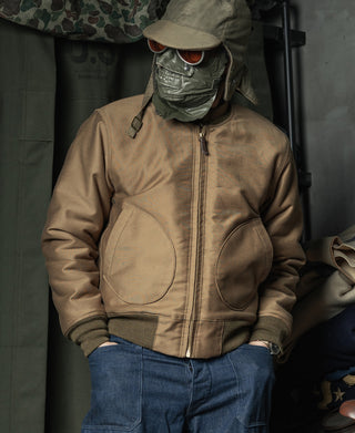 Khaki deck jacket worn with jeans, front view