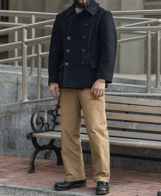 Men's navy double-breasted peacoat with horn-style buttons and front pockets