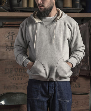 Gray terry hooded sweatshirt with drawstring hood and front kangaroo pocket