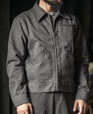 Salt-and-pepper cossack jacket front view with zip, stand collar, and chest pockets