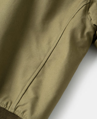Khaki green flight jacket sleeve with ribbed cuff and seam stitching