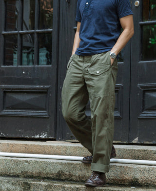 Olive military-style bermuda pants with button fly and cargo pockets