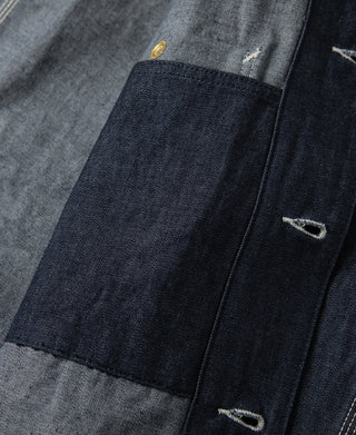 Indigo denim jacket interior pocket with snap closure and bartack stitching