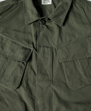 Olive tropical fatigue jacket neckline with button closure and patch pockets