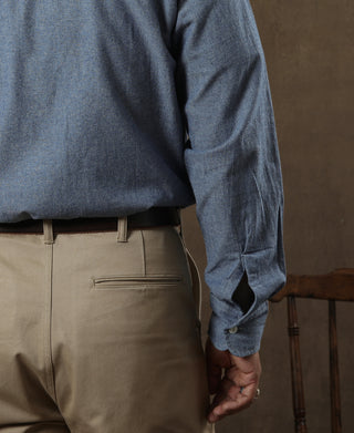 Tan chino trousers with front pocket and side seam near hem