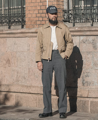 Khaki summer flight jacket on model, zip front and button pocket visible