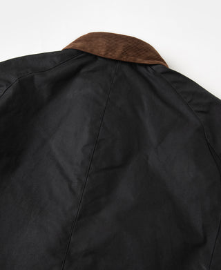 Black waxed chore jacket with brown corduroy collar, back view