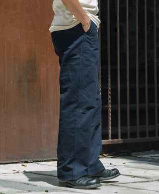 Navy straight-leg officer trousers with pleated front and cuffed hem