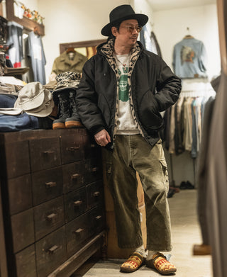 Black reversible deck jacket worn with hood and leopard-print inner lining
