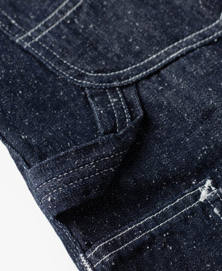 Indigo denim carpenter pants with contrast topstitching and square pocket seam