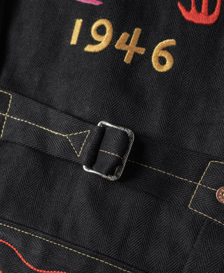 Black tour jacket front strap with metal buckle and “1946” embroidery