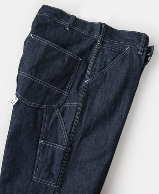 Indigo denim painter pants with button fly and utility patch pockets