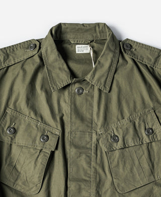 Olive fatigue jacket with button front and flap chest pockets