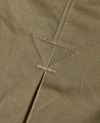 Khaki green jacket back panel with triangular stitch marking