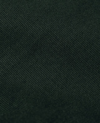Dark green jacket fabric close-up with fine woven texture