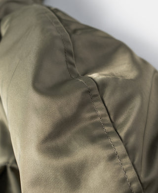 Olive parka shoulder with stitched seam detail