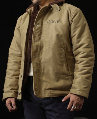Khaki deck jacket with brown sherpa-lined collar and U.S.N. chest embroidery