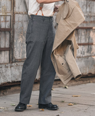 Charcoal gray striped trousers with belt loops and pleated front