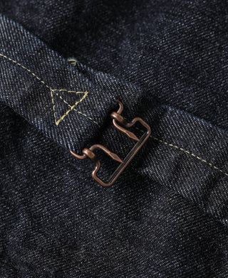 Indigo denim jacket under-flap hardware with two brown metal hooks and yellow stitching