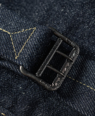 Indigo denim jacket back strap buckle with ornate metal details