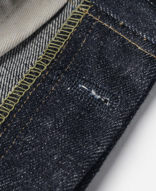 Indigo selvedge denim jeans—selvedge edge detail with small abrasion mark on denim