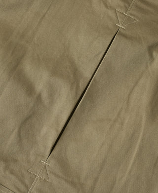 Khaki green jacket side panel seam with diagonal stitched vent