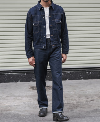 Indigo denim jacket on model with button front and chest pockets