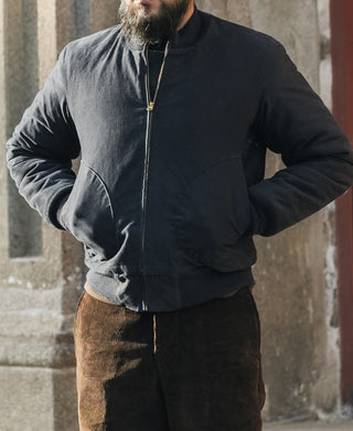 Navy deck jacket with stand collar, zip front, and side welt pockets