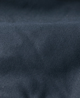 Navy N-1 deck jacket fabric close-up with fine textured weave