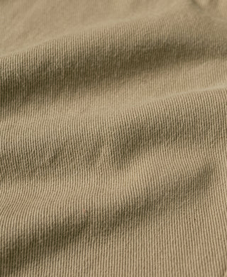 Khaki cotton twill fabric with fine texture, visible close weave detail