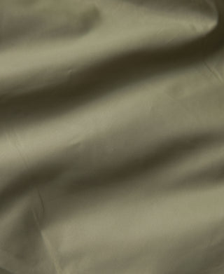 Olive down parka sleeve and shoulder fabric close-up