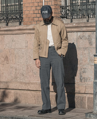 Dark pinstripe pants with straight legs and button waist