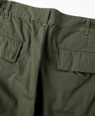 Olive cargo-style fatigue pants with flap pocket and button, close-up