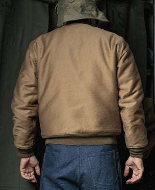 Khaki deck jacket back view with ribbed hem and snap-front cuffs