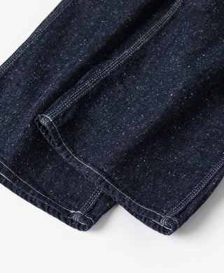 Indigo denim carpenter pants leg hem with double-stitched cuff and dark seam