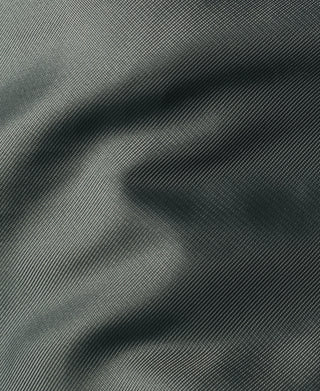 Olive MA-1 flight jacket, close-up of smooth woven fabric texture