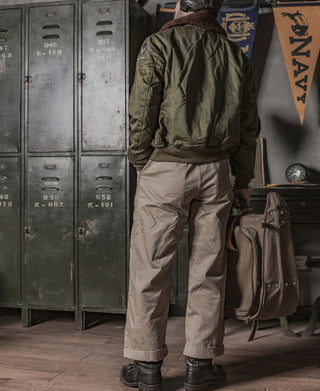 Olive flight jacket back view worn by model with rib hem.