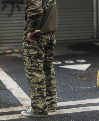Tiger stripe camo fatigue pants with patch cargo pockets and cuffed hem