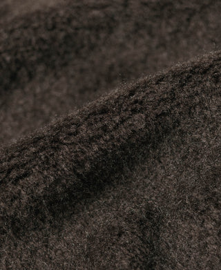 Navy deck jacket fabric close-up with textured knit weave