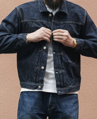 Indigo denim jacket with button front and two chest flap pockets