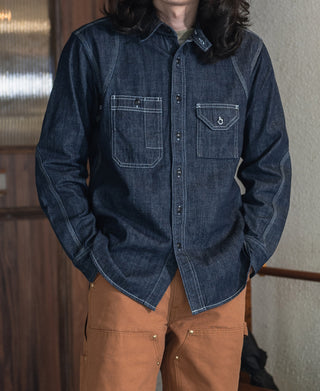 Indigo denim work shirt with two chest pockets and long sleeves, button front