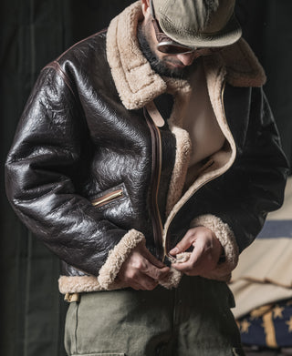 Dark brown leather flight jacket with shearling collar and front zipper
