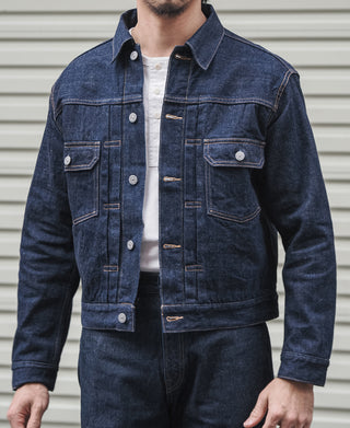 Indigo denim jacket with two chest pockets and metal snap buttons