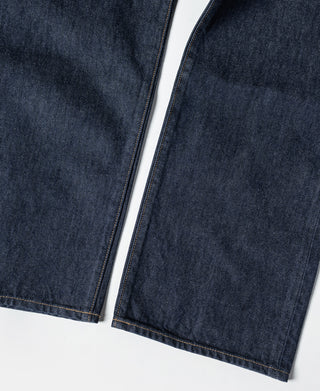 Dark indigo denim jeans with straight legs and visible hem stitching