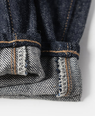 Indigo denim jeans cuff detail with white selvedge stripe and stitched interior