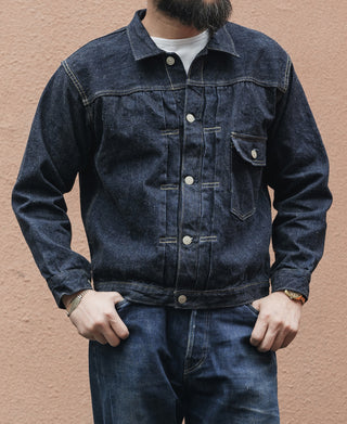 Indigo denim jacket front view with pointed collar and chest flap pockets